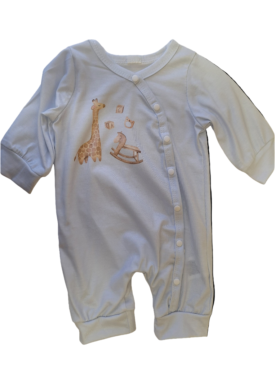 White baby romper with embroidered giraffe and rocking horse design on a black background